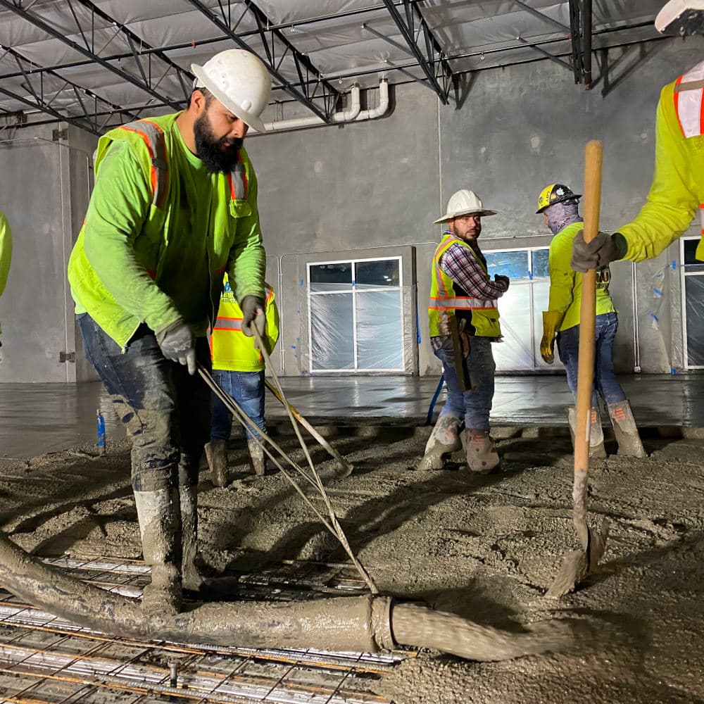 blade runners employee pouring concrete