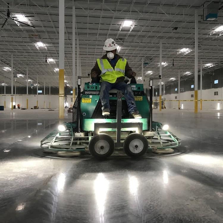 exposed flooring employee operating heavy equipment 2